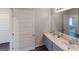 Well-lit bathroom with double sink vanity and a modern mirror, perfect for a Gathering at 1278 Hollingsworth Way # 39, Dacula, GA 30019