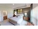 Comfortable bedroom with natural light, neutral colors, and upholstered bed and carpet flooring at 1278 Hollingsworth Way # 39, Dacula, GA 30019