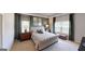 Comfortable bedroom with natural light, neutral colors, and upholstered bed and carpet flooring at 1278 Hollingsworth Way # 39, Dacula, GA 30019