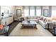 Spacious living room with large area rug, a comfortable sectional sofa, and natural light at 1278 Hollingsworth Way # 39, Dacula, GA 30019