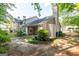 Backyard featuring a cozy covered patio, surrounded by privacy lattice and lush greenery, perfect for relaxing at 701 Ridgelake Dr, Peachtree City, GA 30269