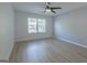 Bedroom featuring ceiling fan, wood look floors and window with blinds at 701 Ridgelake Dr, Peachtree City, GA 30269