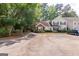 Inviting multi-story townhouse with manicured lawn, ample parking, and classic architectural details at 701 Ridgelake Dr, Peachtree City, GA 30269
