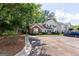 Two-story townhome boasting well-kept landscaping and a visible parking area in a serene community at 701 Ridgelake Dr, Peachtree City, GA 30269