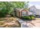 Charming townhome featuring a brick facade, well-maintained landscaping, and a cozy front entrance at 701 Ridgelake Dr, Peachtree City, GA 30269