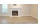 Close up view of the living room's fireplace and the beautiful vinyl plank flooring at 701 Ridgelake Dr, Peachtree City, GA 30269