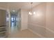 Hallway view of dining room and modern stainless refrigerator at 701 Ridgelake Dr, Peachtree City, GA 30269