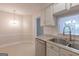 Kitchen featuring granite counters, stainless dishwasher, and view to dining area at 701 Ridgelake Dr, Peachtree City, GA 30269