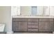 Bathroom vanity with double sinks, granite counters, and dark wood cabinets at 1106 Bakary Ct, Decatur, GA 30032