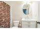 Cozy bathroom with a marble sink, bronze hardware, and shower-tub combo at 1106 Bakary Ct, Decatur, GA 30032