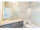 Bathroom with granite countertops, wooden cabinets, and a shower-tub combo at 1106 Bakary Ct, Decatur, GA 30032