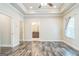 Bedroom with wood floors, recessed lighting, fan, and view of bathroom at 1106 Bakary Ct, Decatur, GA 30032