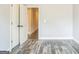 Empty bedroom with neutral paint, hardwood floors, and white doors at 1106 Bakary Ct, Decatur, GA 30032