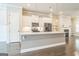 Kitchen boasts a quartz island, stainless appliances and tile backsplash, blending style and function for culinary enthusiasts at 1106 Bakary Ct, Decatur, GA 30032