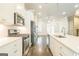 Modern kitchen with stainless steel appliances, a large island, and hardwood floors at 1106 Bakary Ct, Decatur, GA 30032
