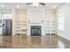 Open floorplan seamlessly integrates the living room, kitchen, and dining area with a fireplace, and shelving at 1106 Bakary Ct, Decatur, GA 30032
