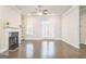 Bright living area with fireplace, hardwood floors, and access to a patio enhancing the comfort and appeal at 1106 Bakary Ct, Decatur, GA 30032