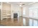 Bright living room featuring hardwood floors and a cozy fireplace flanked by built-in shelving, offering both style and functionality at 1106 Bakary Ct, Decatur, GA 30032