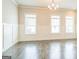 Bright living room with large windows, neutral paint, and hardwood floors at 1106 Bakary Ct, Decatur, GA 30032