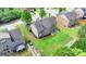 Backyard features a well-manicured lawn and patio, perfect for outdoor entertaining and relaxation at 1370 Sunnys Halo Dr, Suwanee, GA 30024
