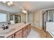 Bathroom with double sinks, a soaking tub and a separate shower with glass door at 1370 Sunnys Halo Dr, Suwanee, GA 30024