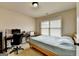 Bedroom features a desk and chair, providing a comfortable space for work or study at 1370 Sunnys Halo Dr, Suwanee, GA 30024