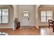 Open foyer featuring hardwood floors and a view of the front door at 1370 Sunnys Halo Dr, Suwanee, GA 30024