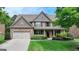 Beautiful two-story brick home with a well-manicured lawn at 1370 Sunnys Halo Dr, Suwanee, GA 30024