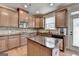 Kitchen with wood cabinets, granite countertops, and stainless appliances at 1370 Sunnys Halo Dr, Suwanee, GA 30024