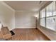 Hardwood floor, lamp and keyboard in this living room at 1370 Sunnys Halo Dr, Suwanee, GA 30024