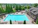Resort-style community pool with lounge chairs, tables, playground, and clubhouse at 1370 Sunnys Halo Dr, Suwanee, GA 30024