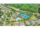 Aerial view of well-maintained tennis courts and community amenities with lush landscaping at 1370 Sunnys Halo Dr, Suwanee, GA 30024