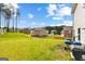 Spacious backyard with lush green grass and lovely views of neighborhood homes at 1003 Nandina Ct, Villa Rica, GA 30180