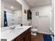 Bathroom featuring vanity, mirror, toilet, and a bathtub with a shower curtain at 1003 Nandina Ct, Villa Rica, GA 30180