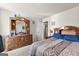 Comfortable bedroom featuring a dresser and a doorway leading to the bathroom, making it well-appointed at 1003 Nandina Ct, Villa Rica, GA 30180