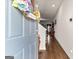 Light and airy entryway featuring wood floors, and a view into the living area at 1003 Nandina Ct, Villa Rica, GA 30180