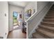 Warm and inviting foyer with wood flooring, a staircase and ample natural light at 1003 Nandina Ct, Villa Rica, GA 30180