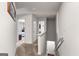 Well-lit upstairs hallway showcasing seamless transition and access to multiple rooms in the house at 1003 Nandina Ct, Villa Rica, GA 30180