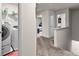 Upstairs hallway with laundry room and bedrooms, creating a seamless flow throughout the home at 1003 Nandina Ct, Villa Rica, GA 30180