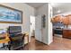 View of office desk area, with a powder room and kitchen in the background at 1003 Nandina Ct, Villa Rica, GA 30180