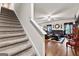 Staircase view of living room showcasing comfortable leather seating and decor at 1003 Nandina Ct, Villa Rica, GA 30180