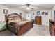 Comfortable main bedroom with carpet flooring, ceiling fan, and closet access at 1003 Nandina Ct, Villa Rica, GA 30180