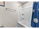 Bathroom showing white shower and tub with a blue patterned shower curtain and towel bar at 1003 Nandina Ct, Villa Rica, GA 30180