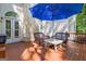 Comfortable outdoor seating and table under an umbrella, perfect for relaxing or entertaining at 229 Terrane Rdg, Peachtree City, GA 30269