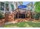 Spacious back deck offers a charming outdoor seating area with stairs to the backyard at 229 Terrane Rdg, Peachtree City, GA 30269