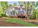 Exterior of home highlighting the spacious backyard and deck, ideal for outdoor activities at 229 Terrane Rdg, Peachtree City, GA 30269