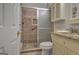 Bathroom featuring walk-in shower with tile surround, tile floor, and granite countertop at 229 Terrane Rdg, Peachtree City, GA 30269