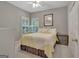 Cozy bedroom with shutters on the windows, ceiling fan, and neutral decor at 229 Terrane Rdg, Peachtree City, GA 30269