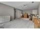 Large bonus room with neutral walls, carpet, ceiling fan, and storage at 229 Terrane Rdg, Peachtree City, GA 30269