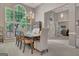 Formal dining room with large arched windows, chandelier lighting, and a view into the office at 229 Terrane Rdg, Peachtree City, GA 30269